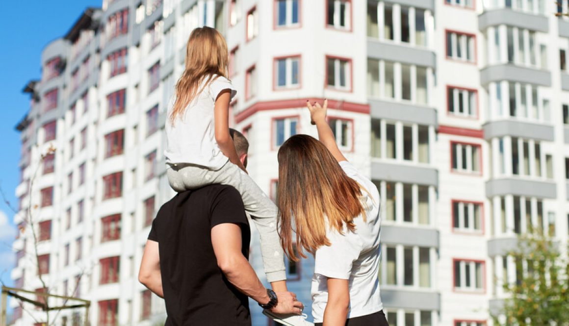 Sporty,Family,Of,Three,Are,Standing,With,Their,Back,To