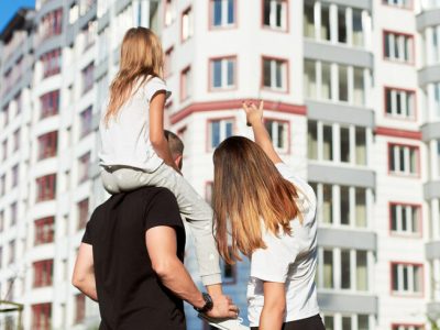 Sporty,Family,Of,Three,Are,Standing,With,Their,Back,To